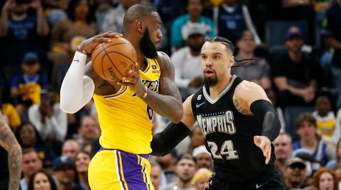 Grizzlies forward Dillon Brooks defends Lakers forward LeBron James.
